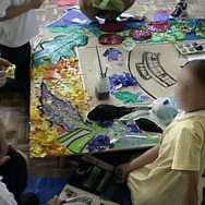 Group of children making collage on table